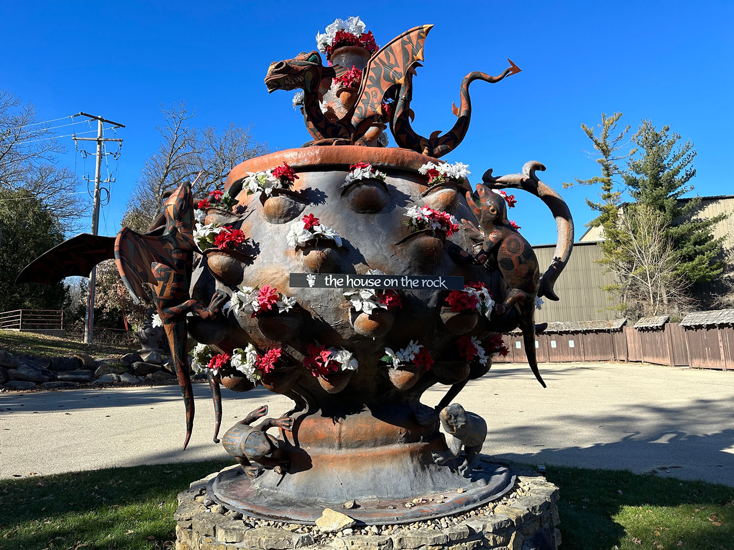 Large planter with dragons with the House on the Rock label